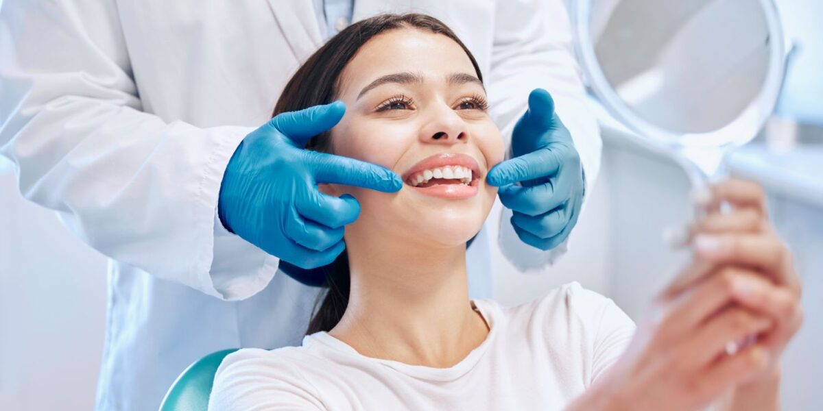 A woman smiling at her dental appointment