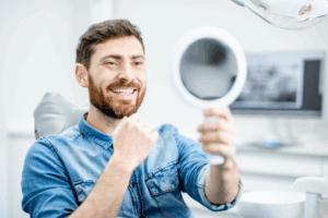 a man smiling in a mirror